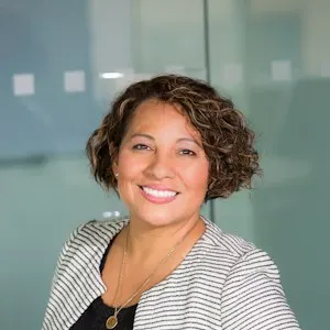 Portrait of the session's host, smiling